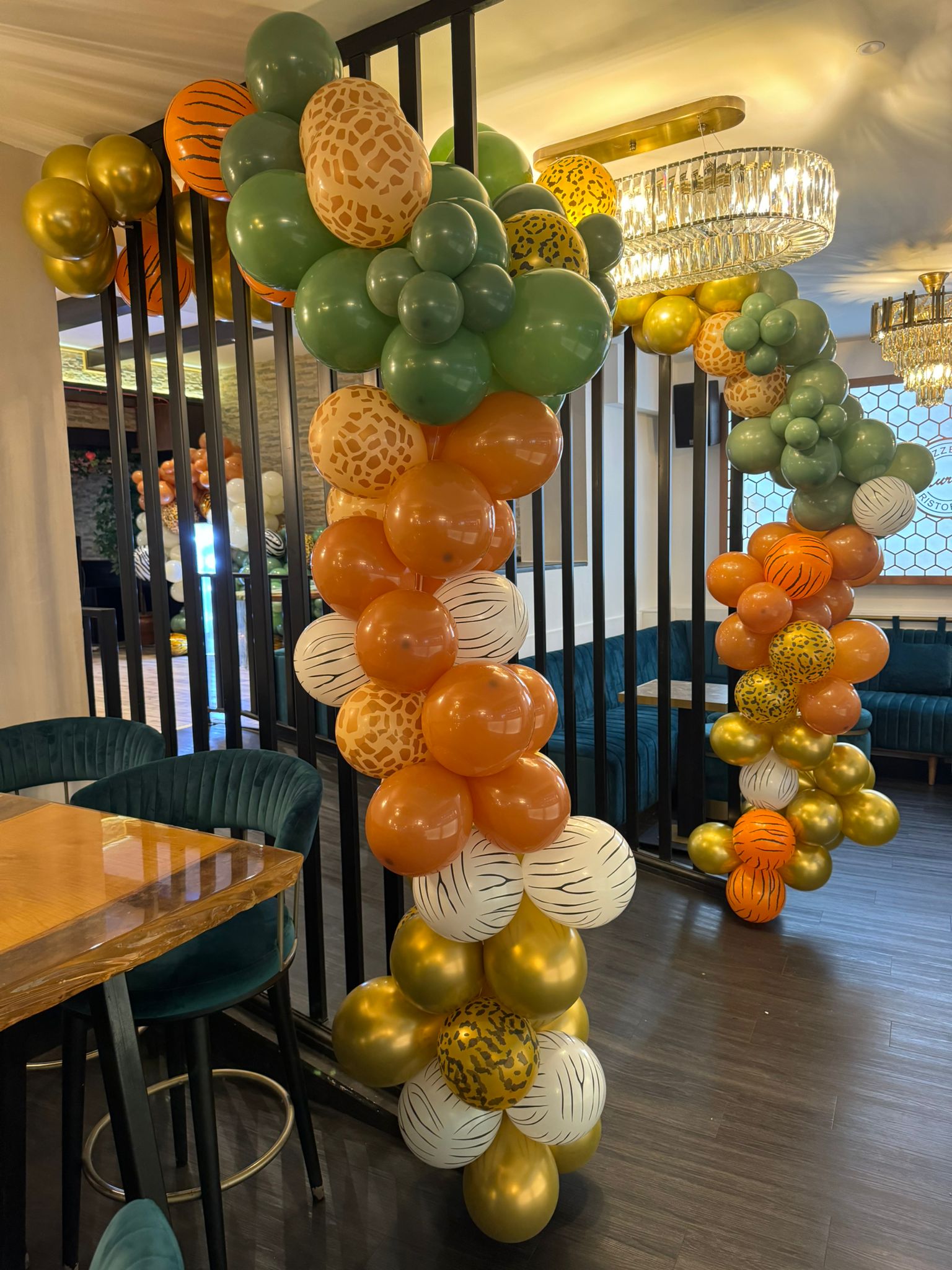 Corporate event backdrop with balloon arch and branding